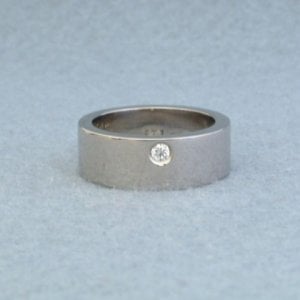 10th carat diamond engagement ring set in a chunky 18k white gold ring.jpeg