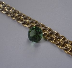 Tourmaline next to 18k white and yellow gold.jpg