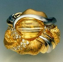 220px-cynnabar_ring_for_hillary_clinton_1992_inaugural_ball.jpg