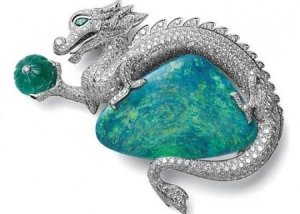 cartier__opal__holding_ribbed_emerald__emerald_eyes.jpg