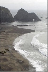 View of the Beach surrounded by cliffs.JPG