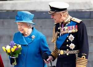 The Queen and Prince Philip hold hands as they leave St Paul's Cathedral in March 2015 in London.jpg