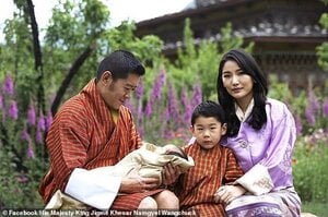 King Jigme Khesar Namgyel Wangchuck and Queen Jetsun Pema shared their first photos as a famil...jpg