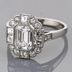 1c2566a26fbc66d7cb2885b9ed346522--emerald-cut-engagement-rings-art-deco-engagement-rings.jpg