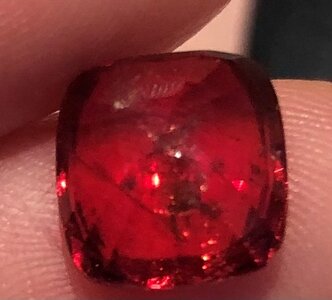 Brown red spinel indoor back inclusion.jpg