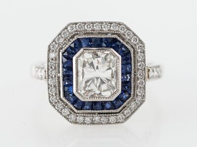 Engagement-Ring-Modern-1.23-Round-Brilliant-Cut-Diamond-1.22-French-Cut-Sapphires-in-Platinum-...jpg