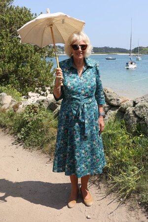 camilla-duchess-of-cornwall-smiles-during-a-walk-on-bryher-news-photo-1626877528.jpg