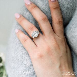 2-25-ct-oval-with-half-moon-side-stones-engagement-ring.jpg