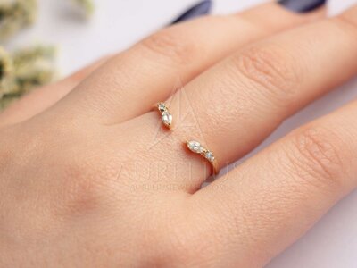 open-diamond-wedding-band-on-finger.jpg