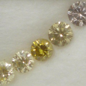 Collection of lilac, yellows and green diamonds in diffused light