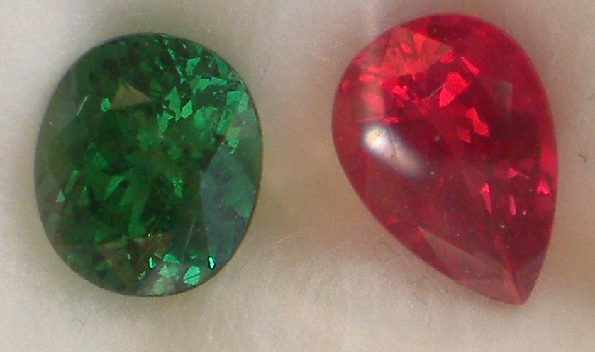 2.1 ct tsavorite and 2.2 ct AIGS certified pinkish orange Tanzanian spinel