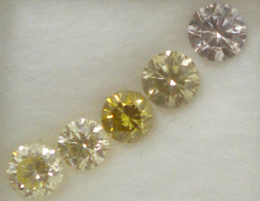 Collection of lilac, yellows and green diamonds in diffused light