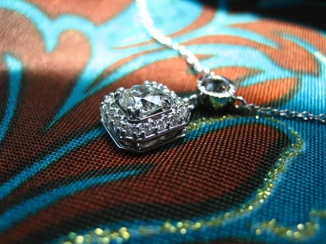 LTP's .46 ct. OEC pendant with bezel set .20 ct. OMC