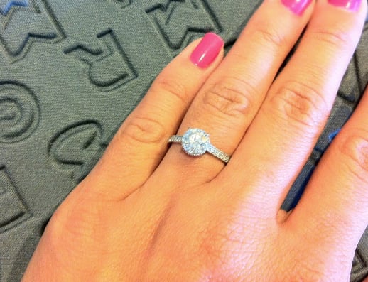 Custom diamond engagement ring on the hand