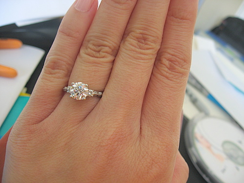 1 carat diamond ring on finger