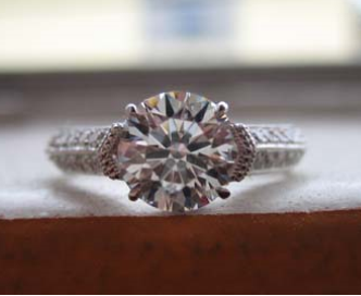 Kcoursolle originally posted this magnificent engagement ring upgrade on the Show Me the Bling forum at PriceScope. When kcoursolle’s engagement ring was damaged, she was upset for a long time! What a stunning replacement, that would make a sour moment a whole lot sweeter! What is your favorite aspect of this beauty?