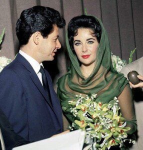 Elizabeth Taylor wearing the diamond heart pendant necklace at her wedding to Eddie Fisher in 1959.
