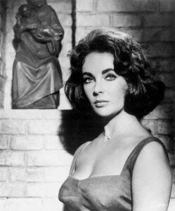 Elizabeth Taylor wearing the diamond heart pendant necklace on the set of "Suddenly Last Summer" in 1959.