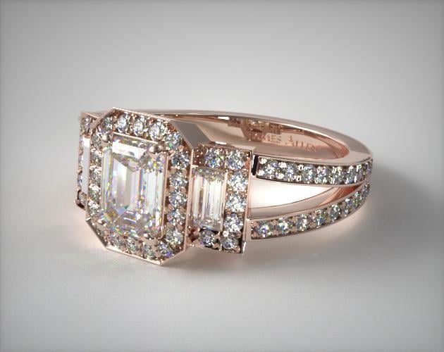 A 14K Rose Gold Emerald Three Stone Engagement Ring.