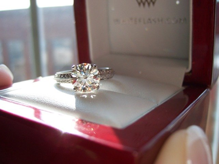 Diamond engagement ring in a red and white ring box