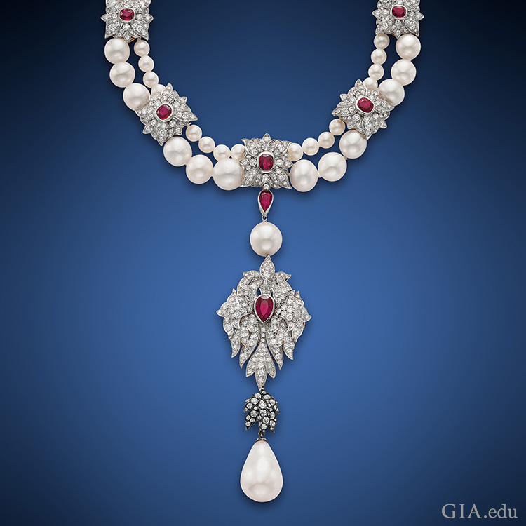 Cartier set Elizabeth Taylor’s historic 50.56 ct La Peregrina pearl as part of the pendant to this two-strand pearl, ruby and diamond necklace.