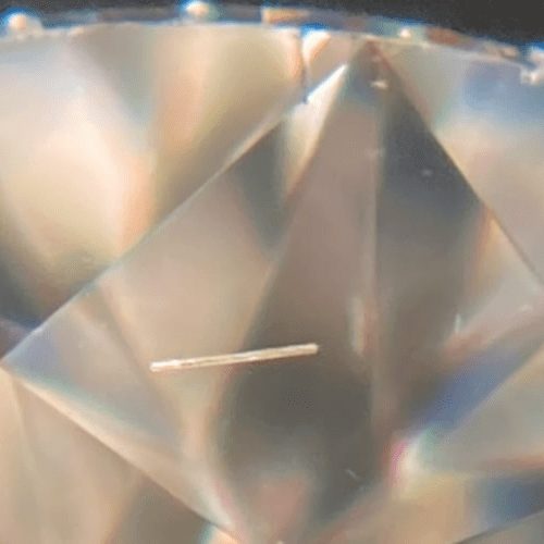 Common in HPHT diamonds, these inclusions are long and thin, often aligning with the crystal growth pattern.